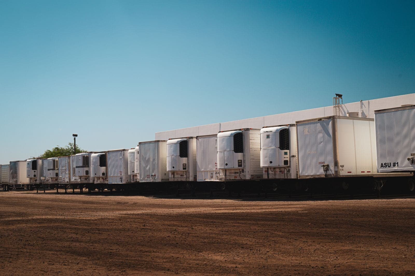 Refrigerated trailers parked in a row