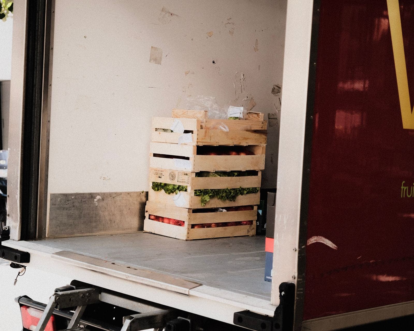 Crates of produce in the back of a truck